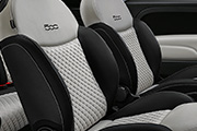 Dedicated black sand Matelassé fabric seats with techno leather details